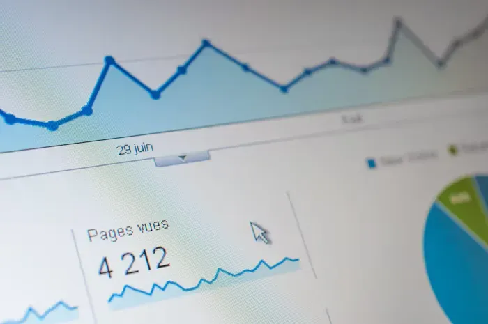 Close-up of an analytics dashboard showing a line chart, a pie chart and a page-views panel