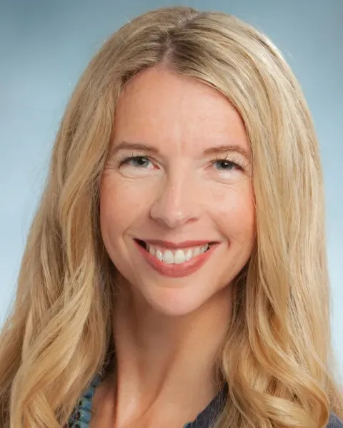 Portrait of Kristin Tilquist, smiling, with long blond hair